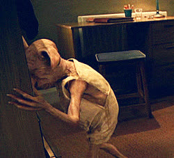 Dobby from Harry Potter with his hands against a cabinet, moments before banging his head in frustration.