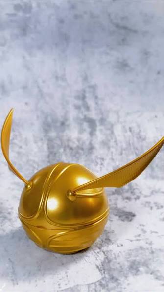 The original smooth gold plastic Tim Hortons Golden Snitch Timbits Holder.