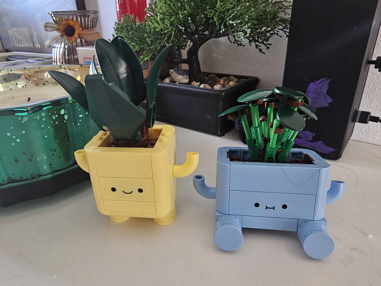 Completed LEGO Botanicals Happy Plants build with yellow and blue plant pots