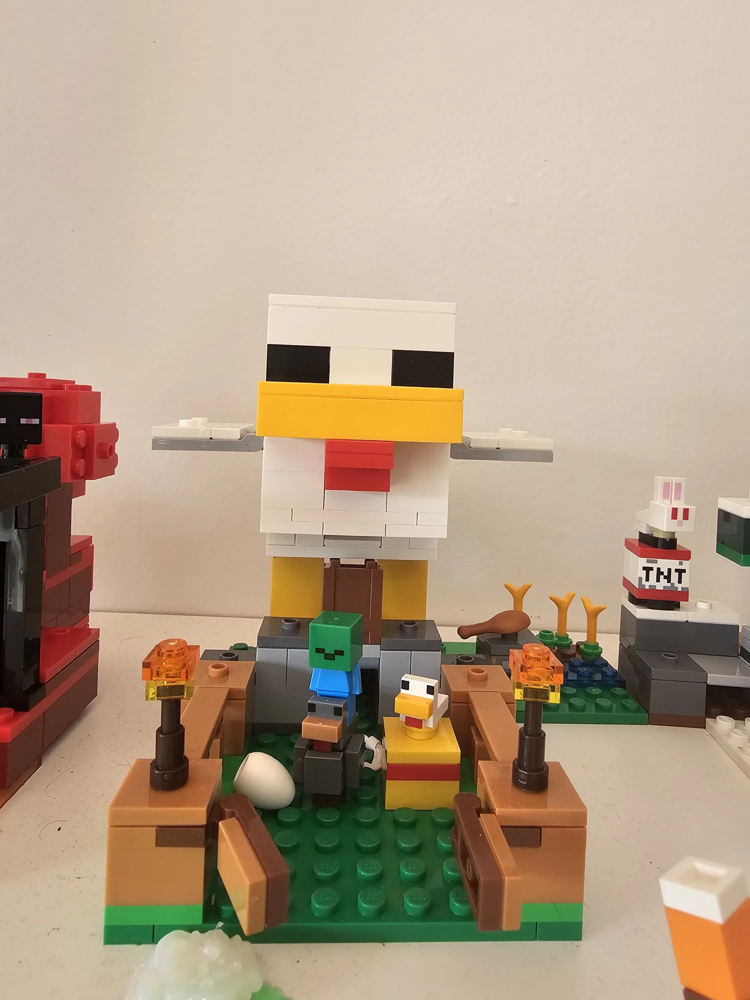Completed LEGO Minecraft Chicken Farm build with the large chicken structure and figures
